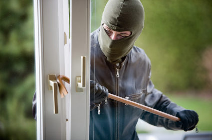 Man committing burglary offence